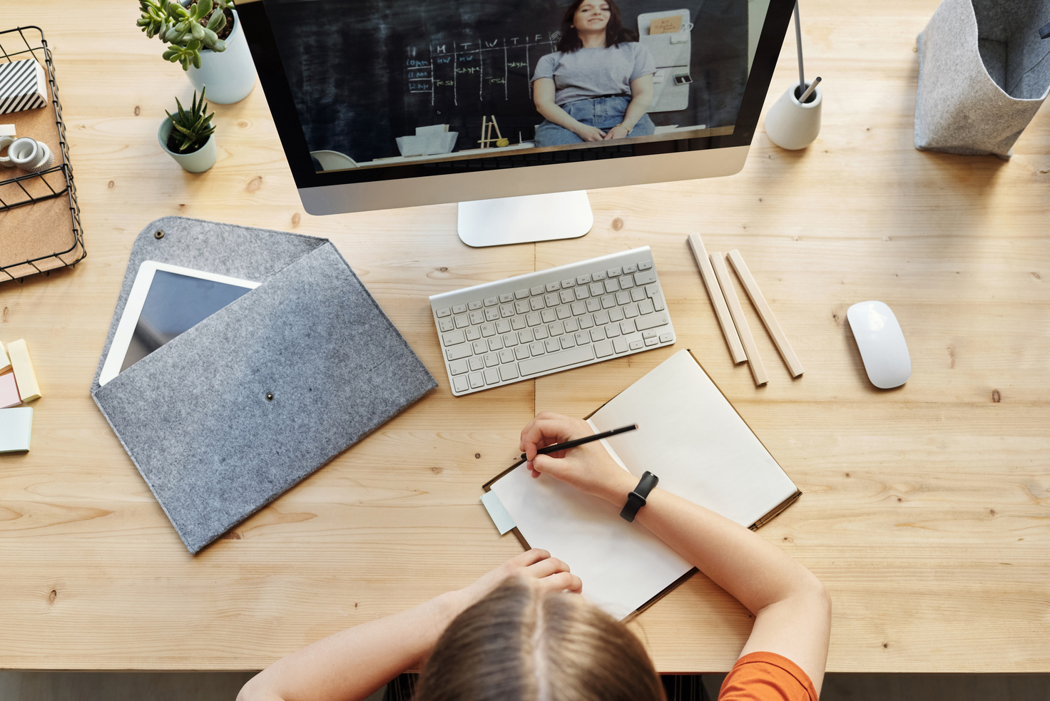 Top View Photo of Person Writing on White Paper